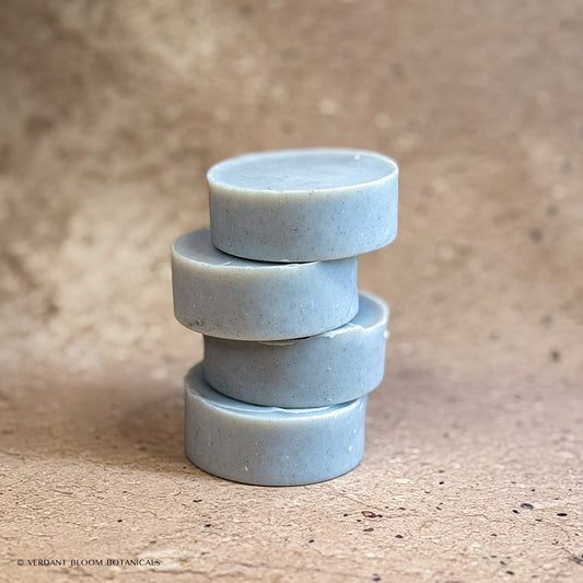 Stack of Common Ground mini soap bars