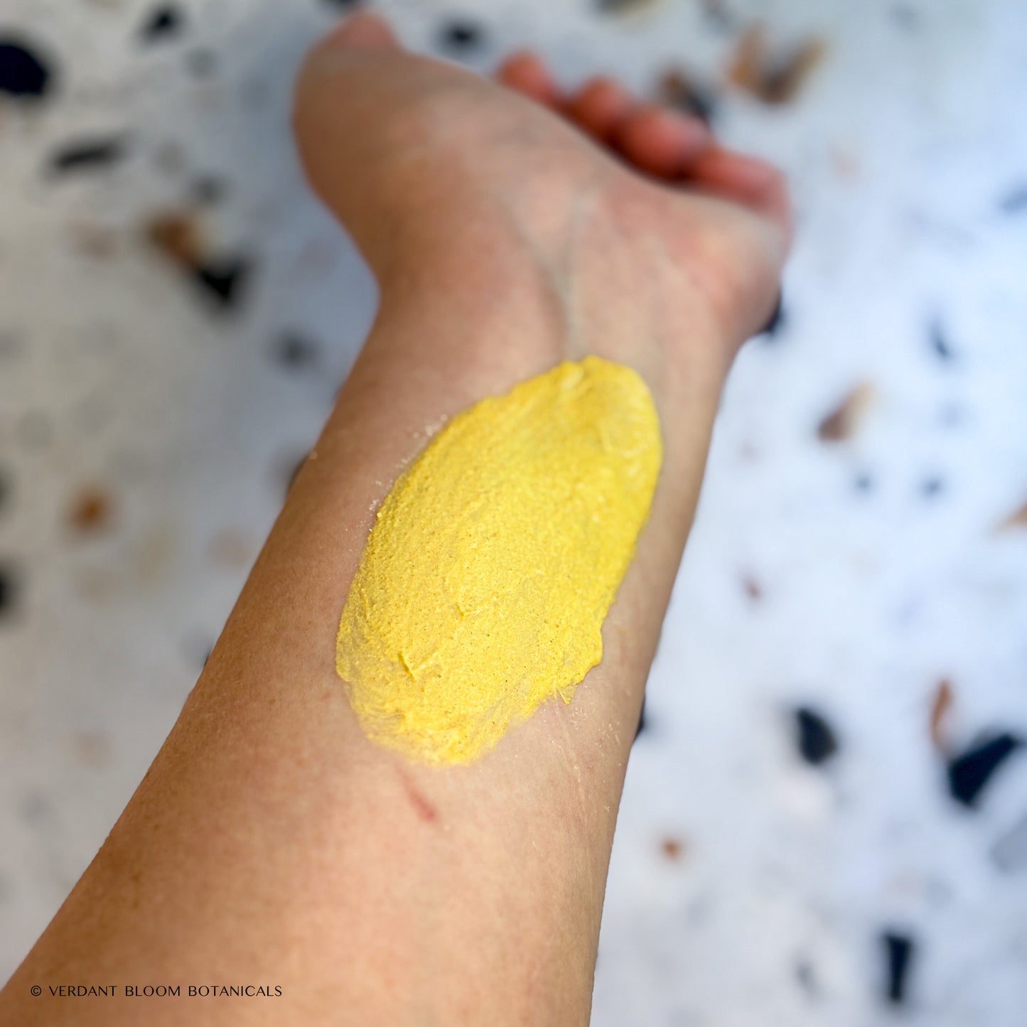 Mixed Glow Boost face mask applied to arm