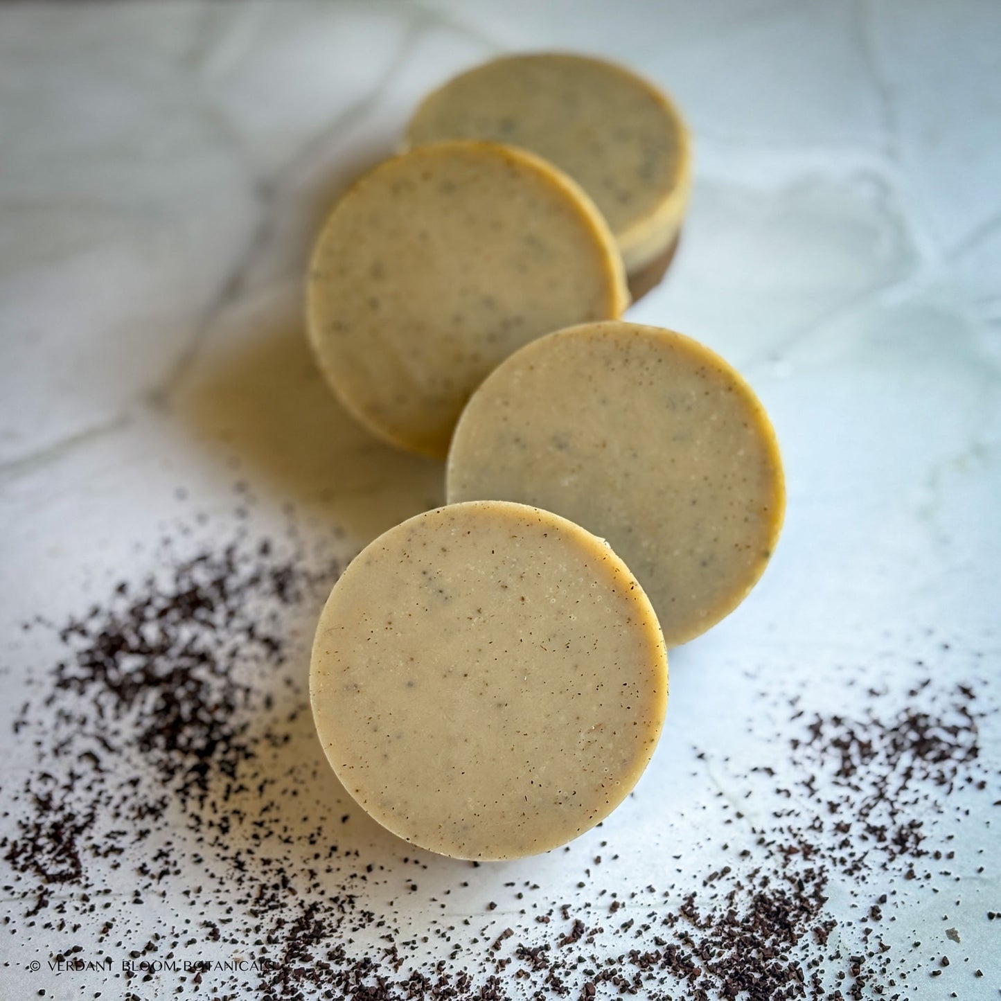 Handmade exfoliating mini soap with ground coffee
