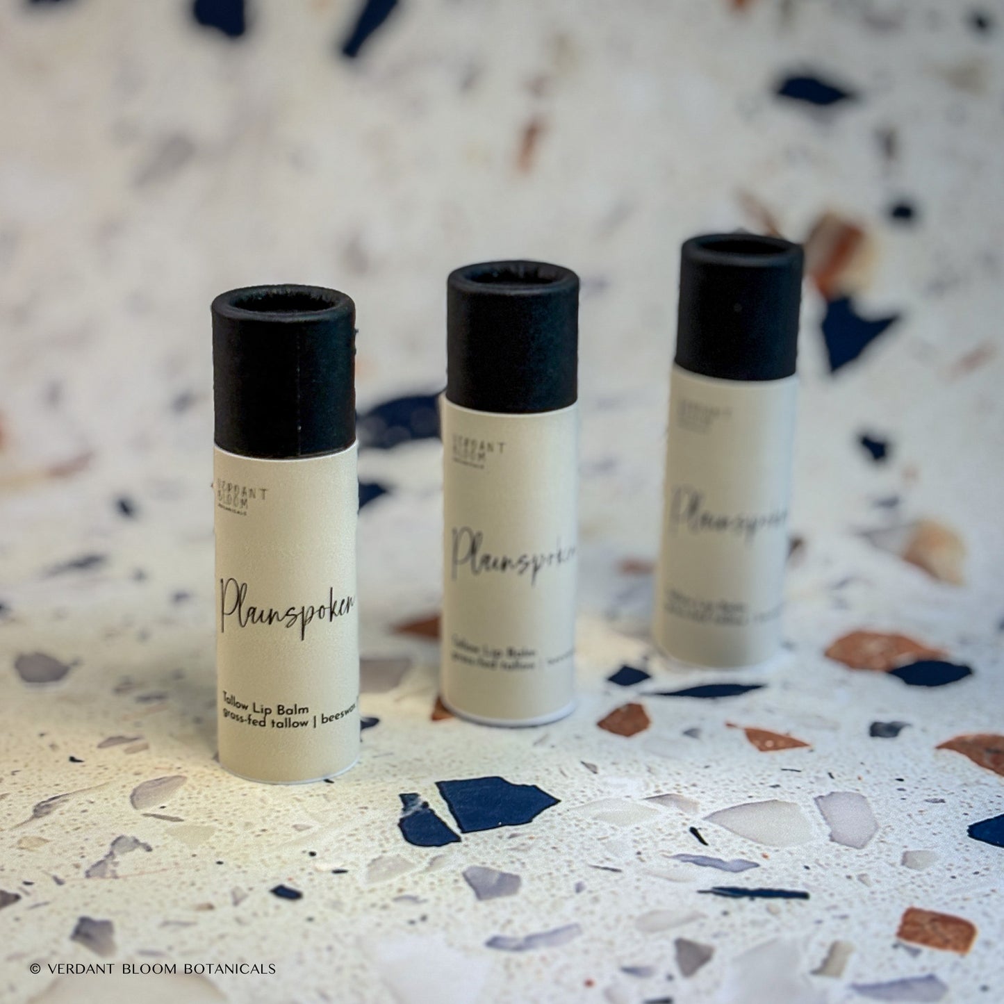 Three tubes of Plainspoken lip balm