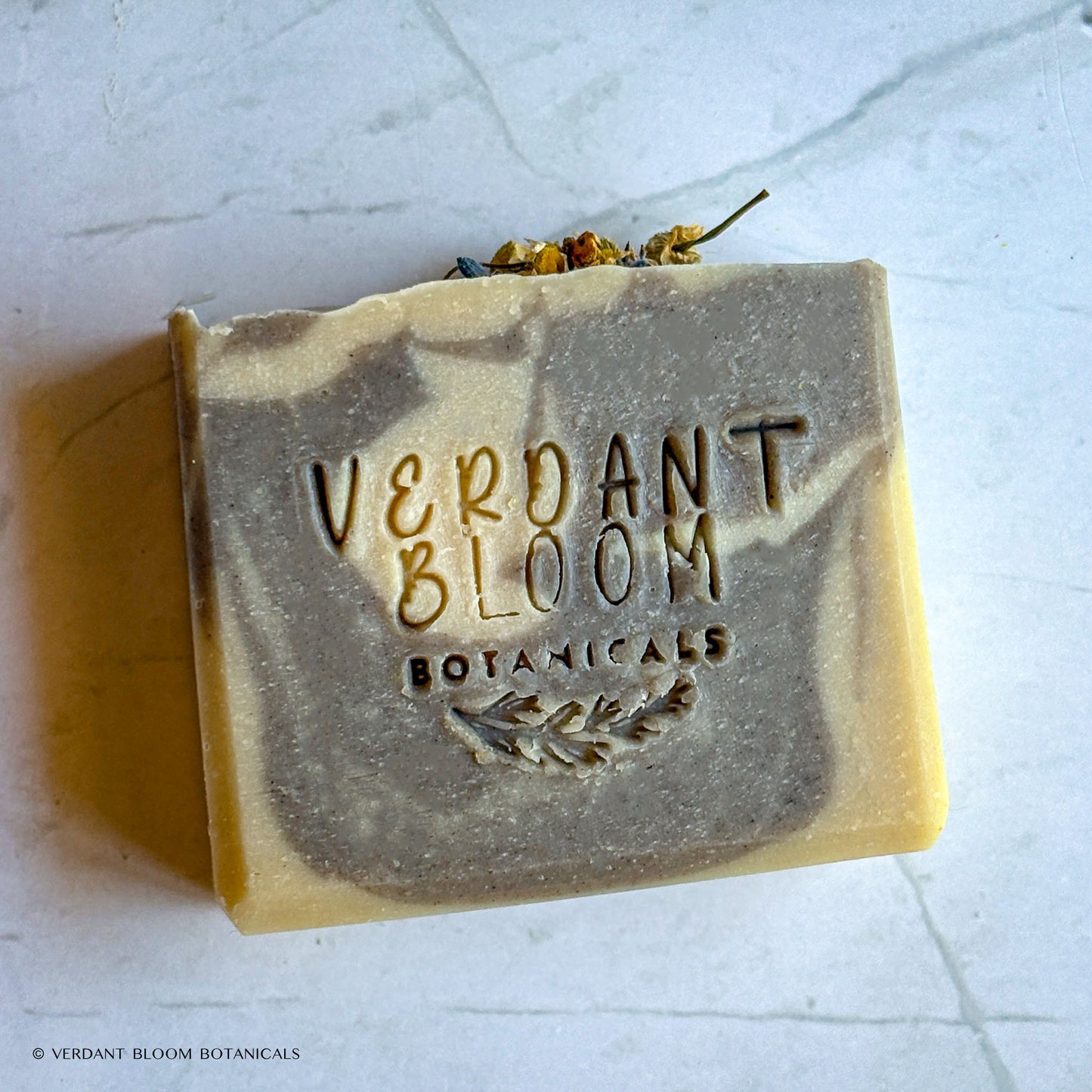 Tranquil Bloom soap stamped with logo