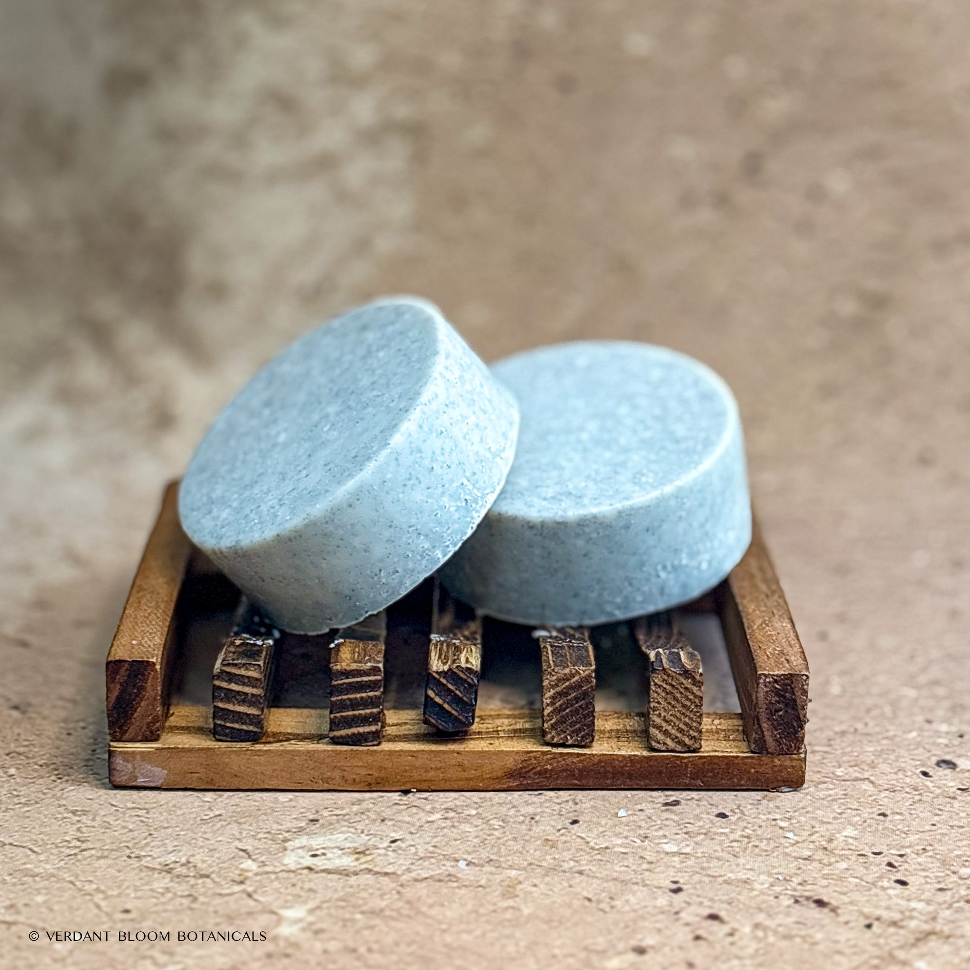 two Clean Slate mini salt bars on wooden soap holder
