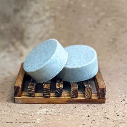 two Clean Slate mini salt bars on wooden soap holder