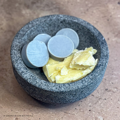 Collection of Common Ground mini soaps in bowl with shea butter