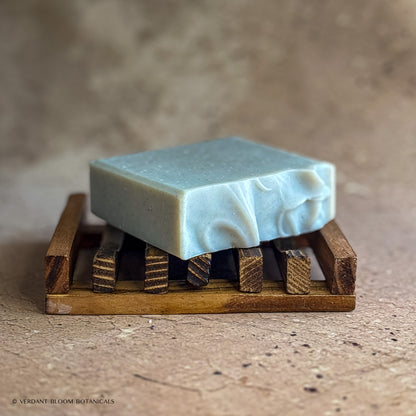 Common Ground soap bar on wooden holder
