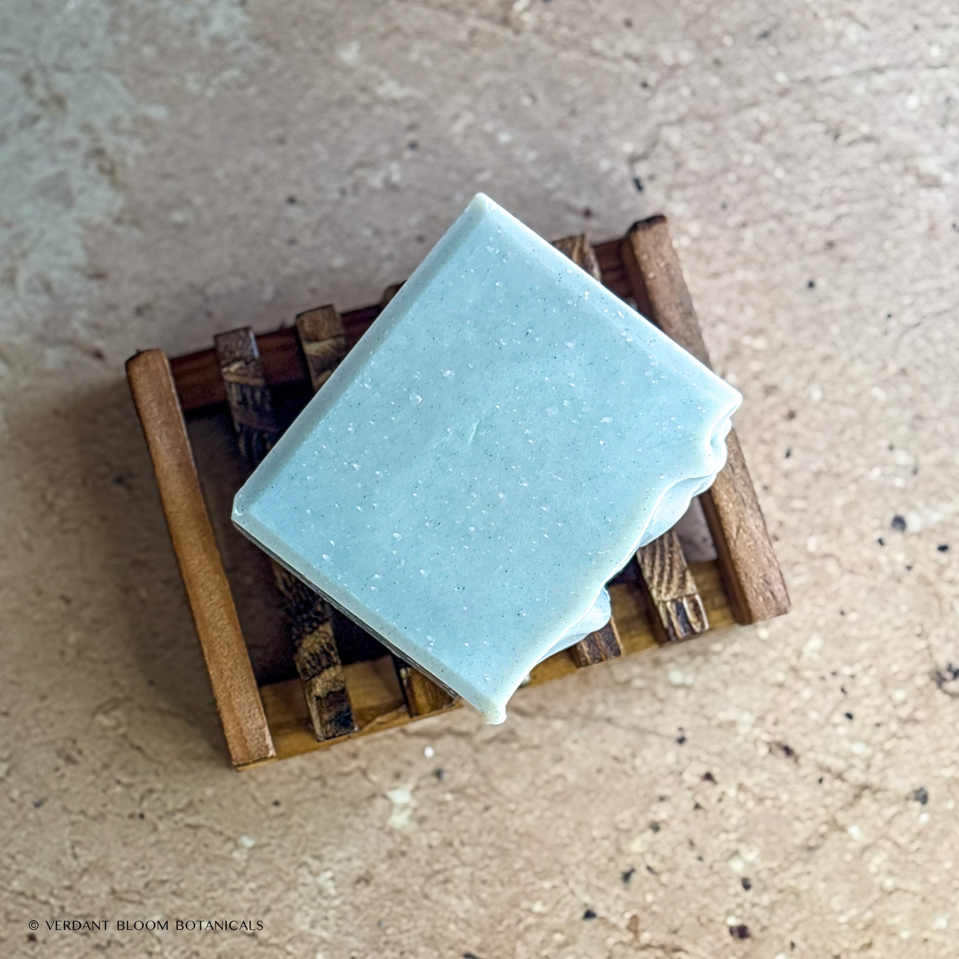 Common Ground soap bar on wooden holder