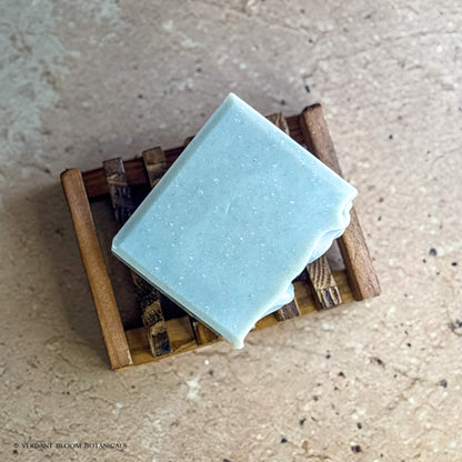 Common Ground soap bar on wooden holder