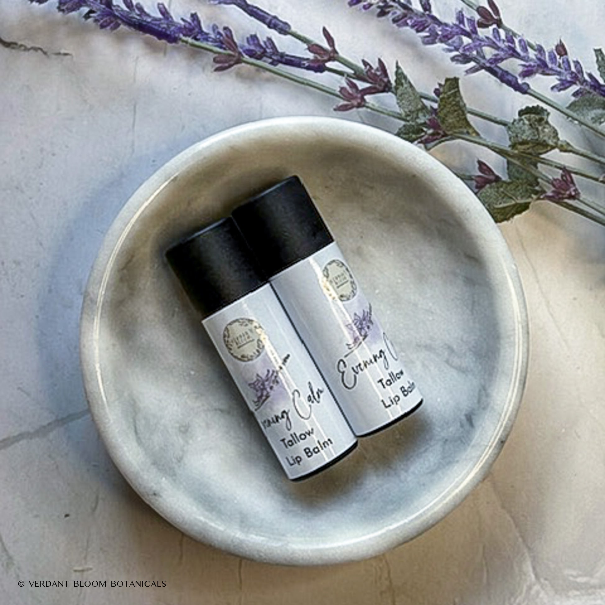 two tubes of Evening Calm lip balm in bowl