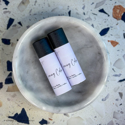 Two tubes of Evening Calm lip balm in bowl