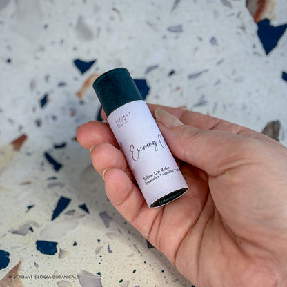 Evening Calm lip balm being held in hand