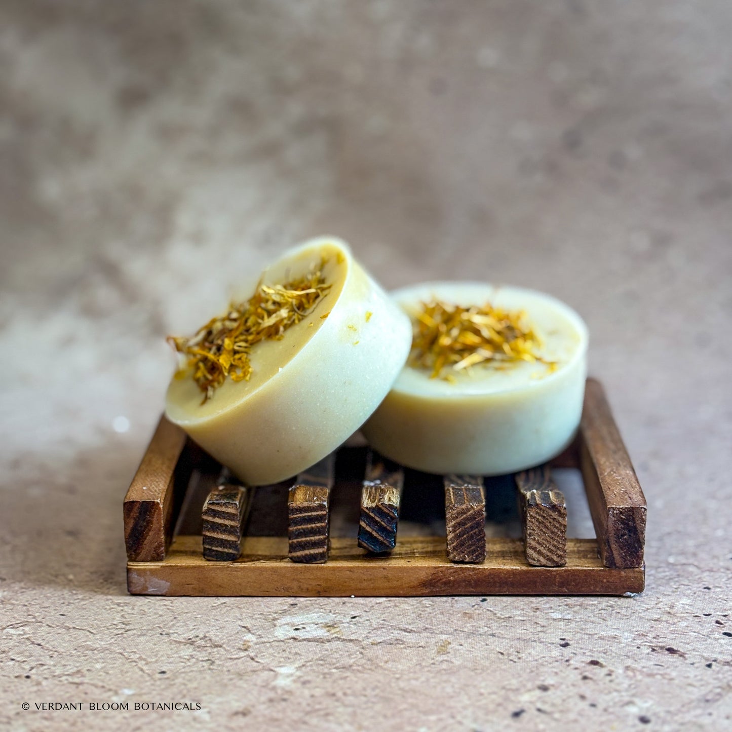 two First Light mini soaps on wooden soap holder