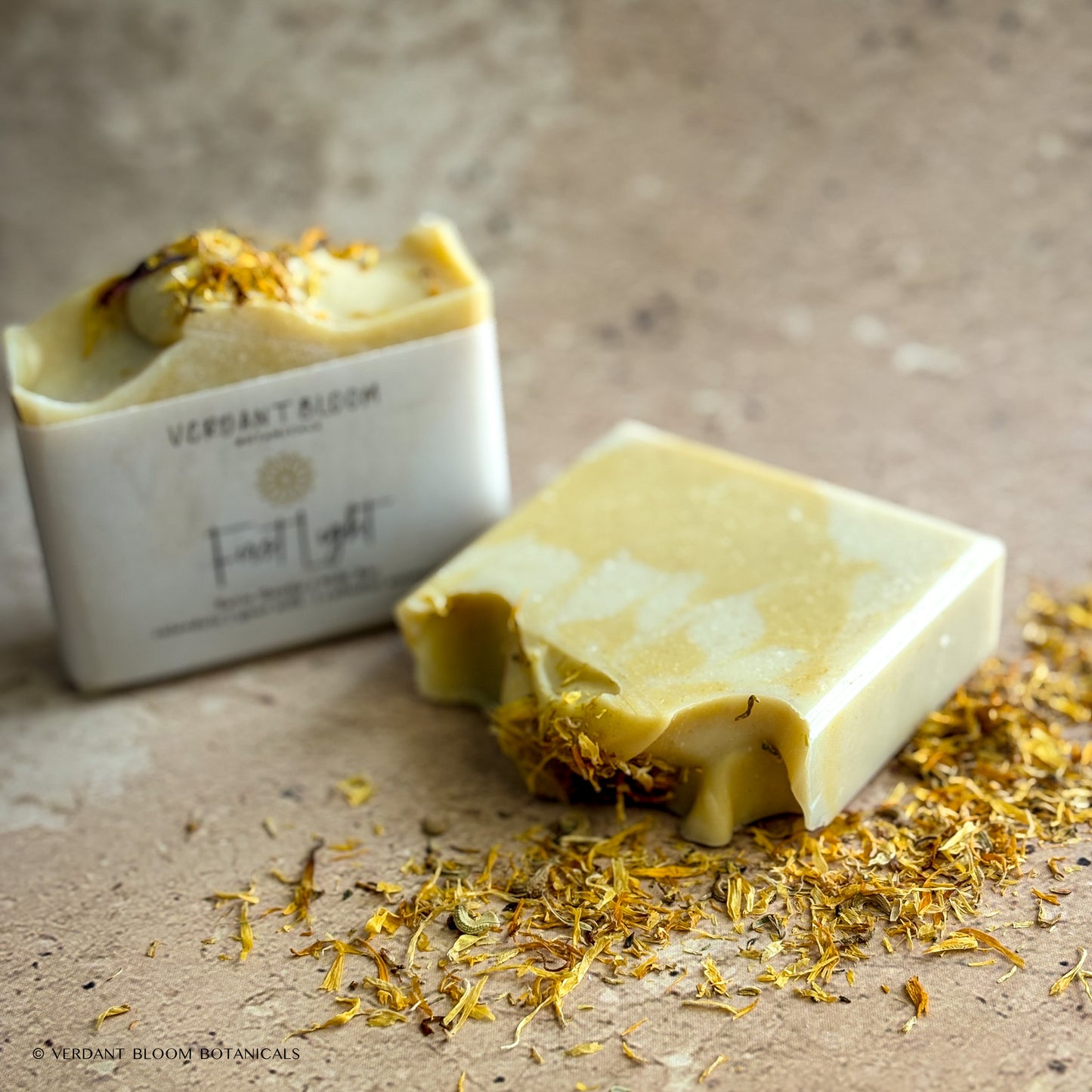 two bars of First Light soap bars with dried calendula