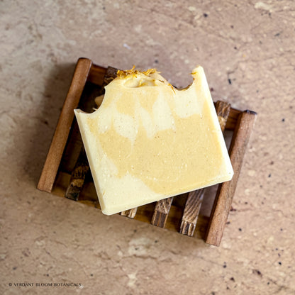 First Light soap bar on wooden soap holder
