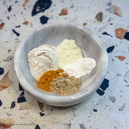 a bowl holding ingredients for Glow Boost face mask