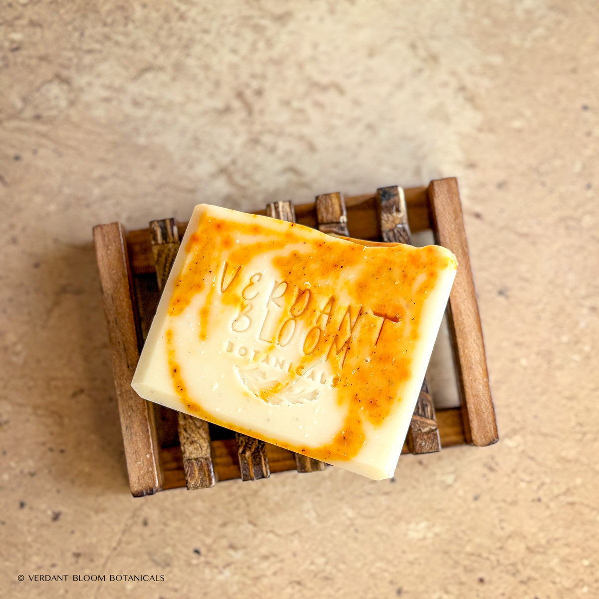 Golden Comfort soap bar on wooden soap tray