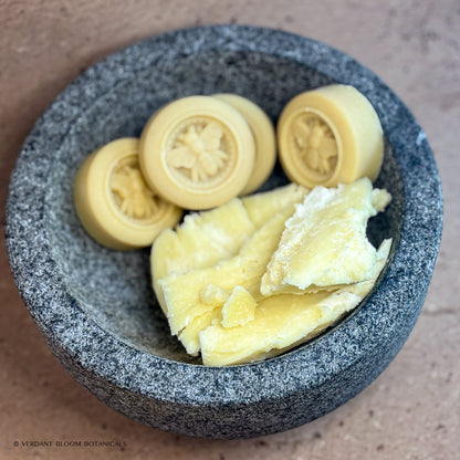 collection of Milk & Honey mini soaps in bowl with shea butter