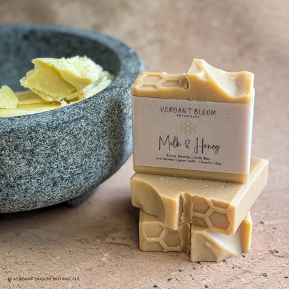 Milk & Honey soap bars next to shea butter in bowl