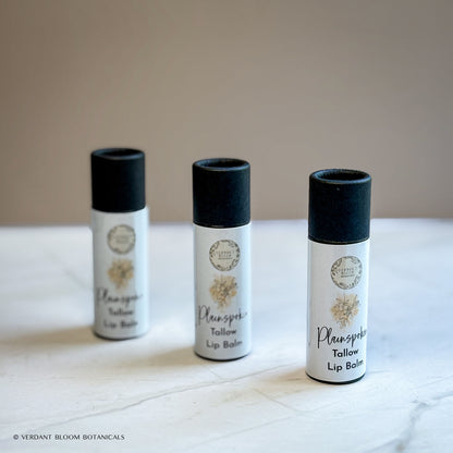 three tubes of Plainspoken lip balm standing next to each other