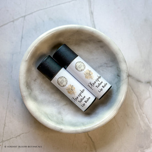 two tubes of Plainspoken lip balm in a bowl