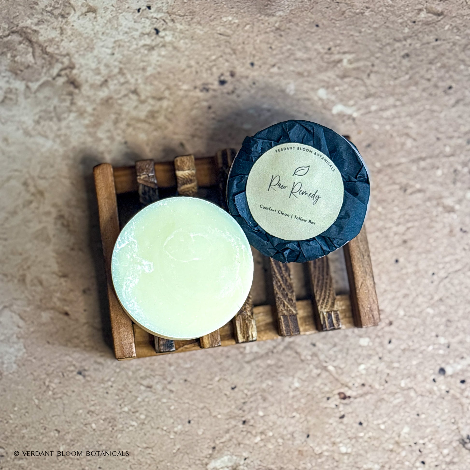 two Raw Remedy mini soaps on wooden soap holder