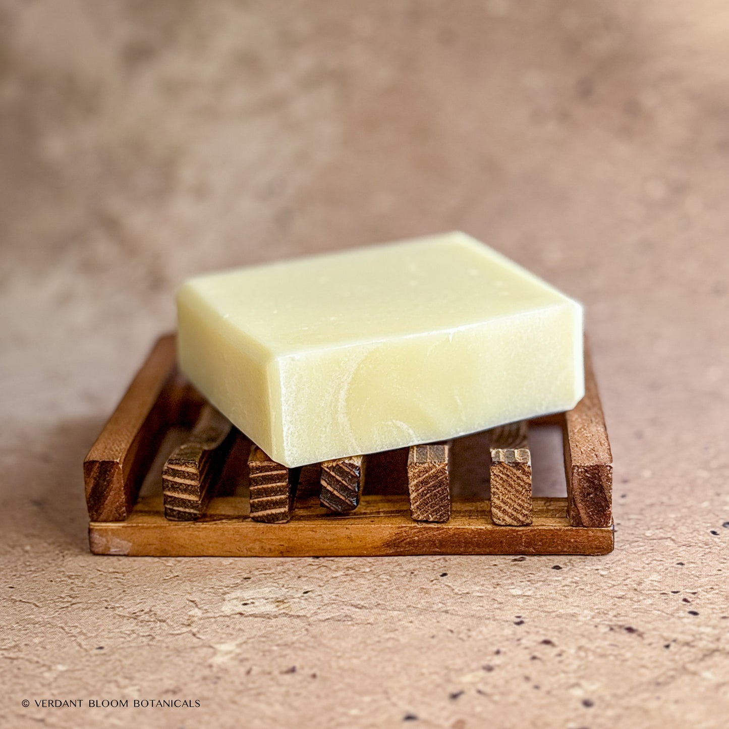 Raw Remedy soap bar on wooden soap holder