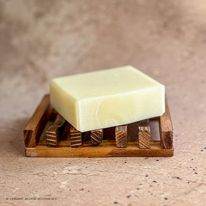 Raw Remedy soap bar on wooden soap holder