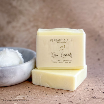 Raw Remedy soap bars next to bowl holding tallow