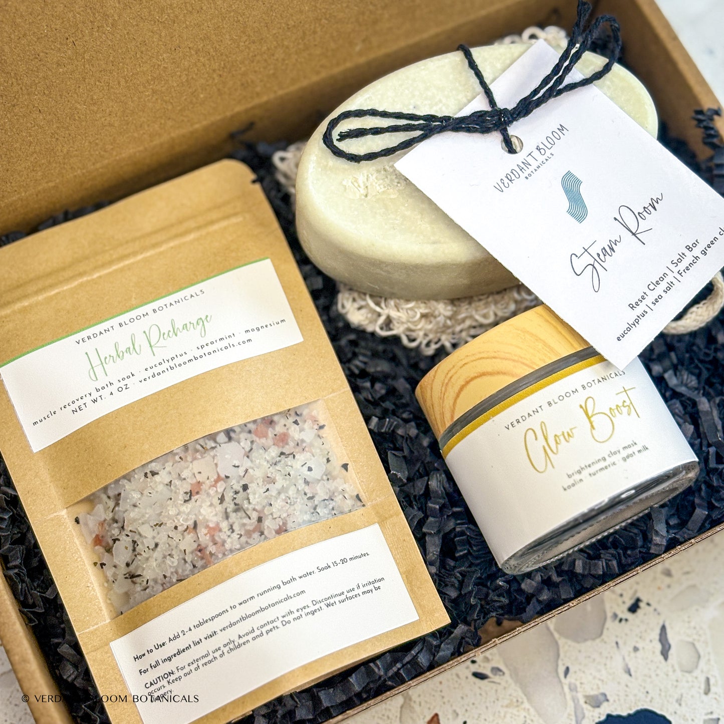 Recovery Kit containing bath soak, face mask, salt bar, and sisal soap bag in gift box