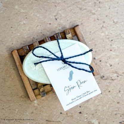 Steam Room salt bar with label on wooden soap holder