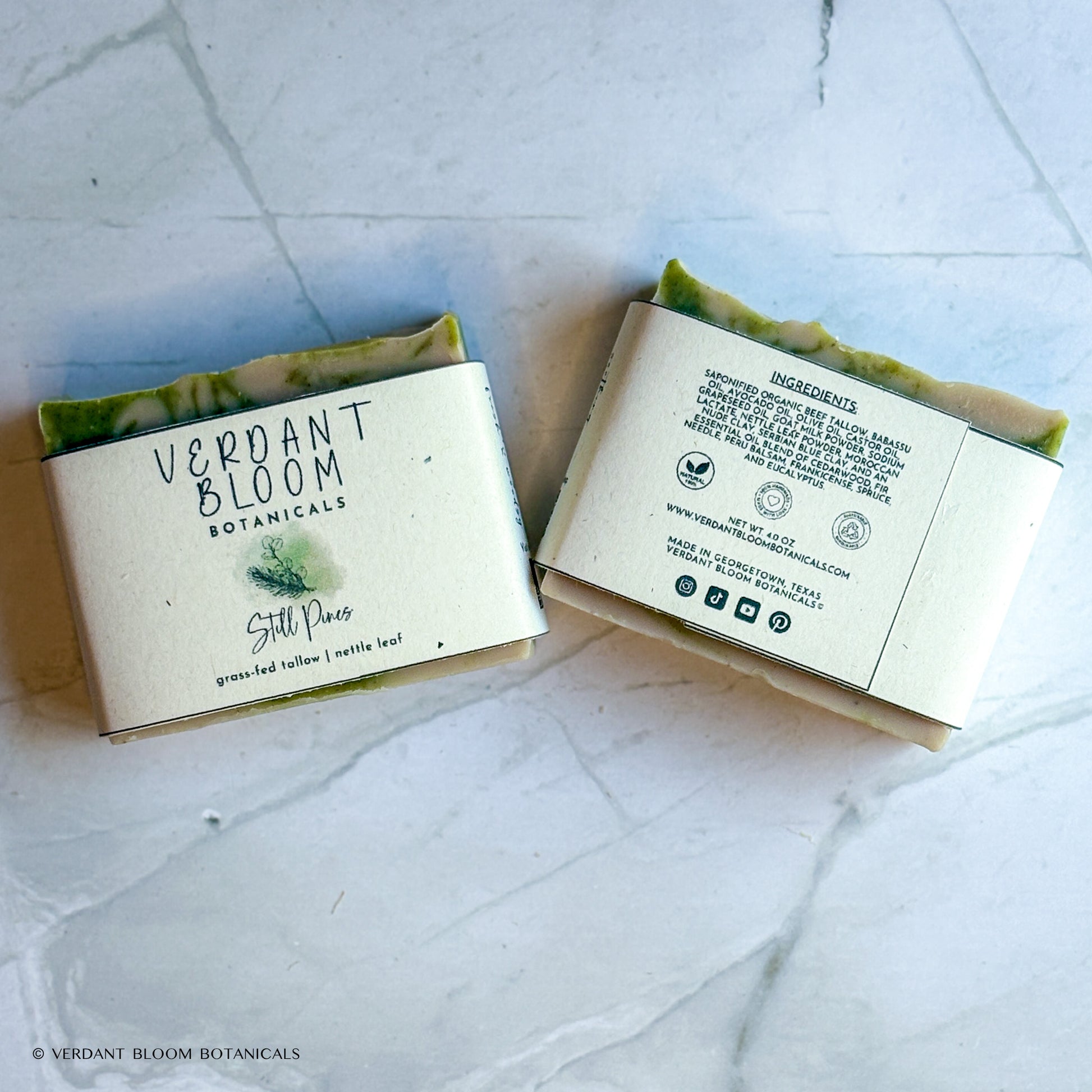 Hand‑cut Still Pines tallow soap bar in a green‑gray hue with natural clay texture and subtle botanical speckling.