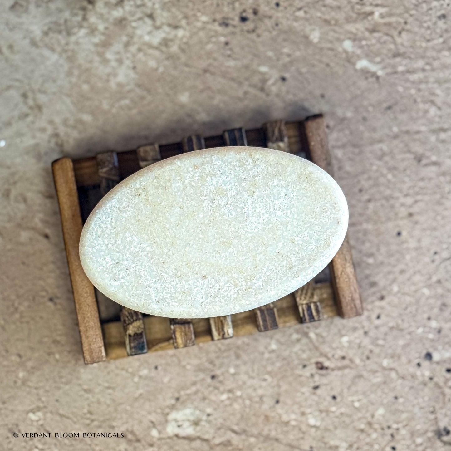 Warm Stone salt bar on wooden soap holder