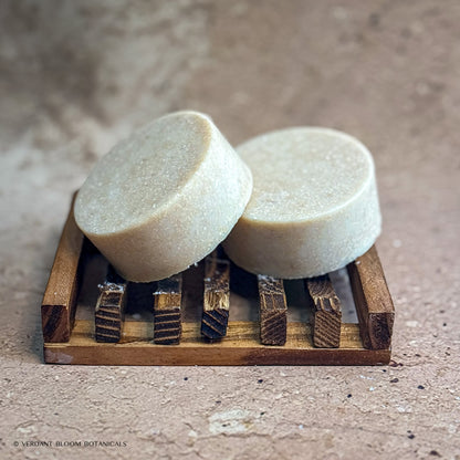 two Warm Stone mini salt bars on wooden soap holder