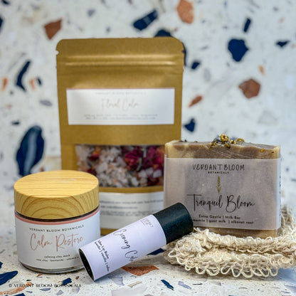 Wind-Down kit containing bath soak, face mask, goat milk soap, lip balm, and sisal soap bag