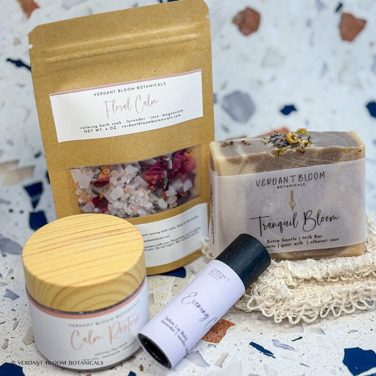 Wind-Down kit containing bath soak, face mask, goat milk soap, lip balm, and sisal soap bag