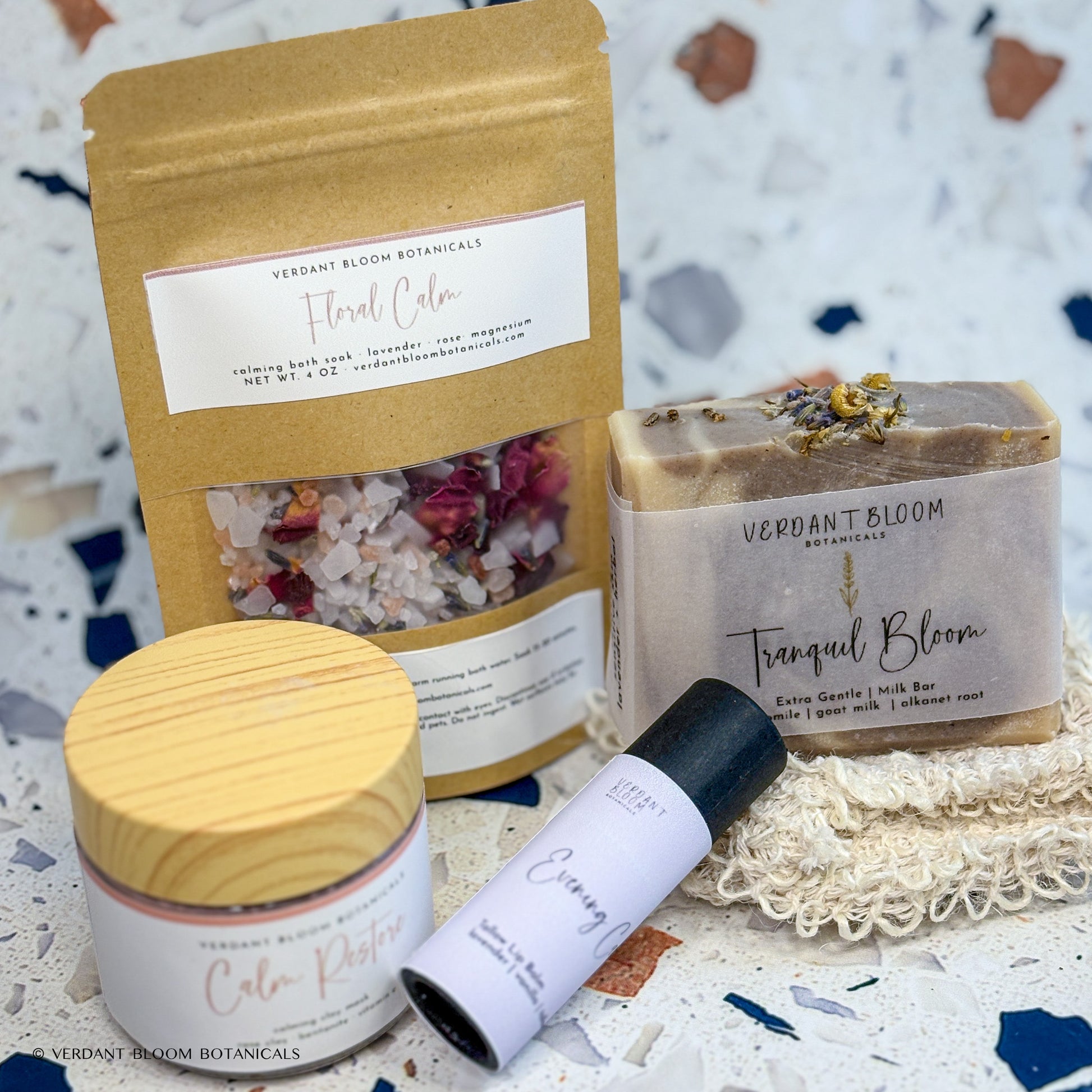 Wind-Down kit containing bath soak, face mask, goat milk soap, lip balm, and sisal soap bag