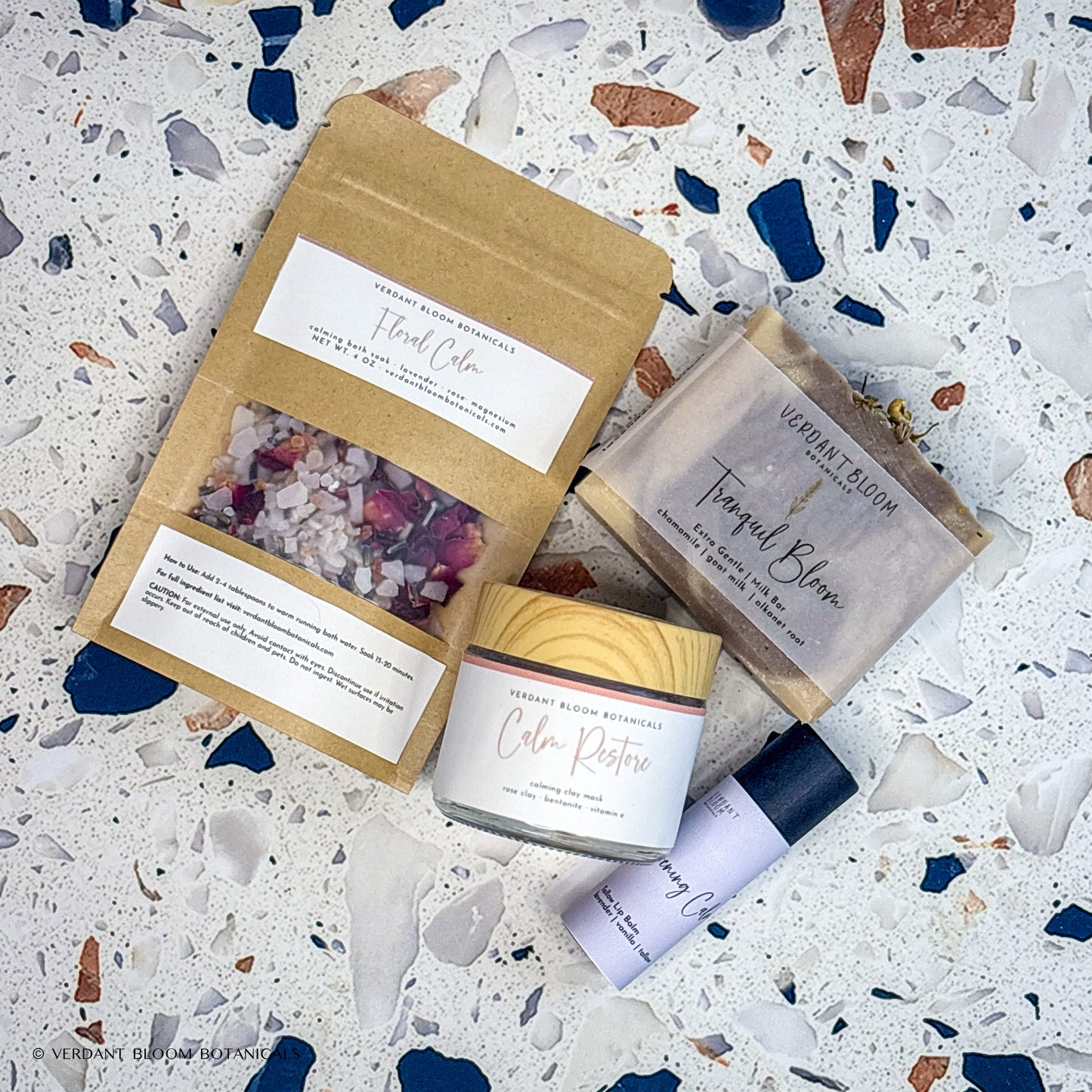 Wind-Down kit containing bath soak, face mask, goat milk soap, lip balm, and sisal soap bag